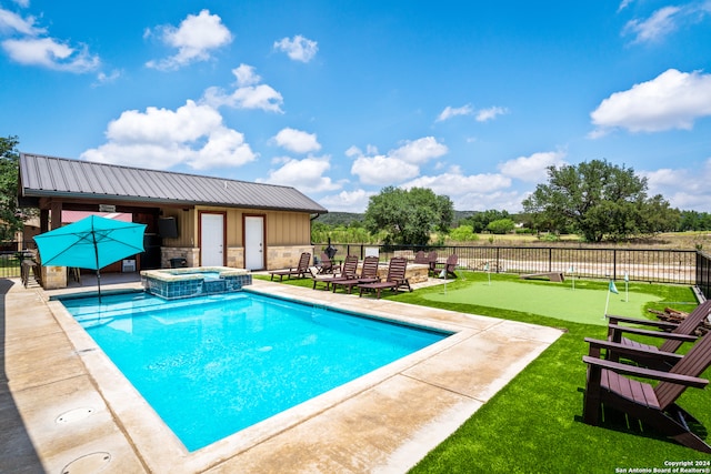 view of pool with a patio area and an in ground hot tub