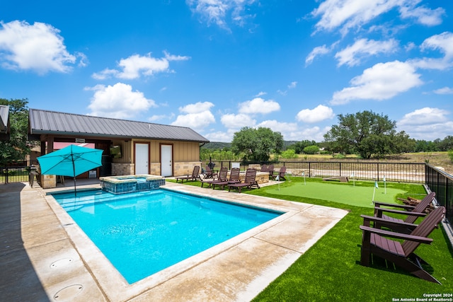 view of swimming pool with a patio area and an in ground hot tub