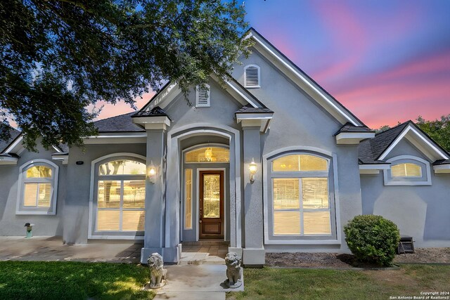 view of front of home with a lawn