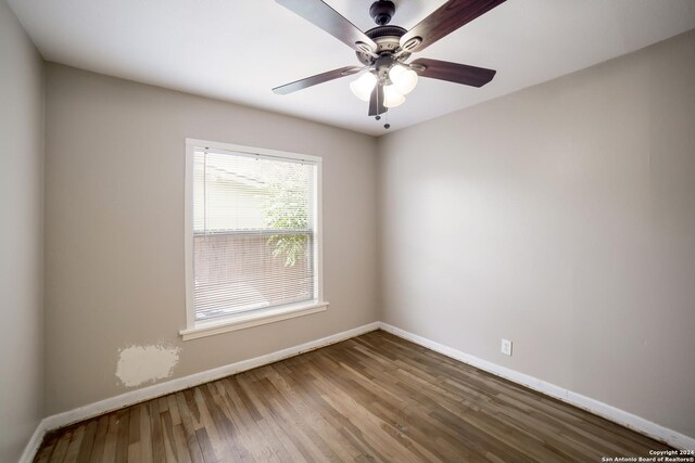 unfurnished room with ceiling fan and hardwood / wood-style floors