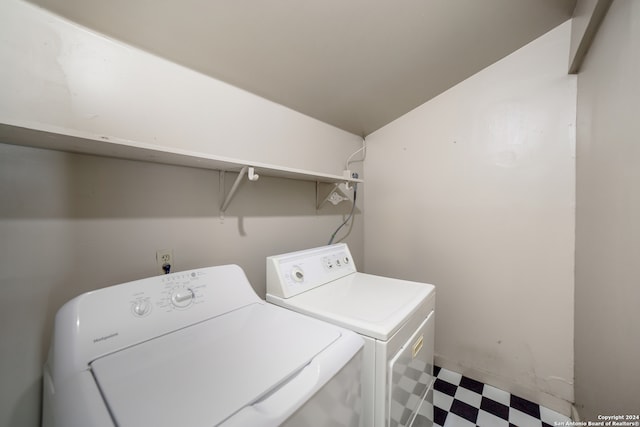 laundry room featuring separate washer and dryer and tile patterned floors