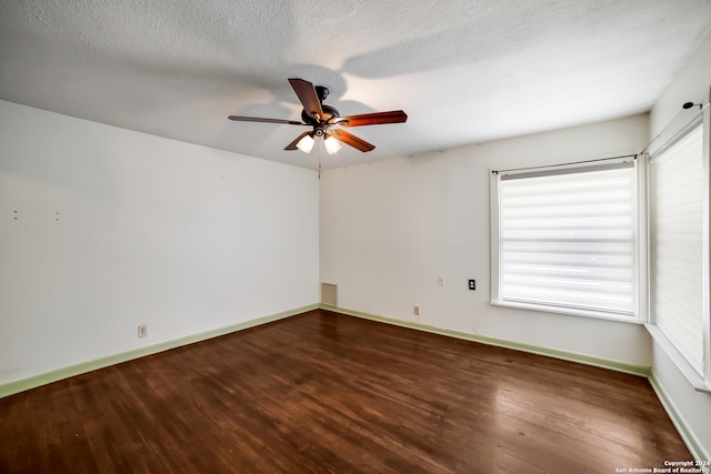 spare room with a textured ceiling, ceiling fan, and hardwood / wood-style floors