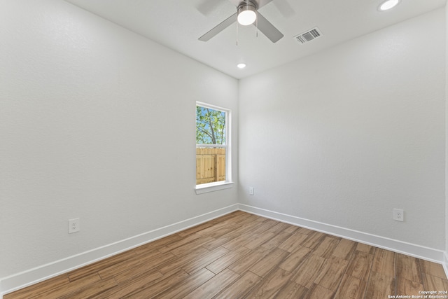 unfurnished room with hardwood / wood-style flooring and ceiling fan