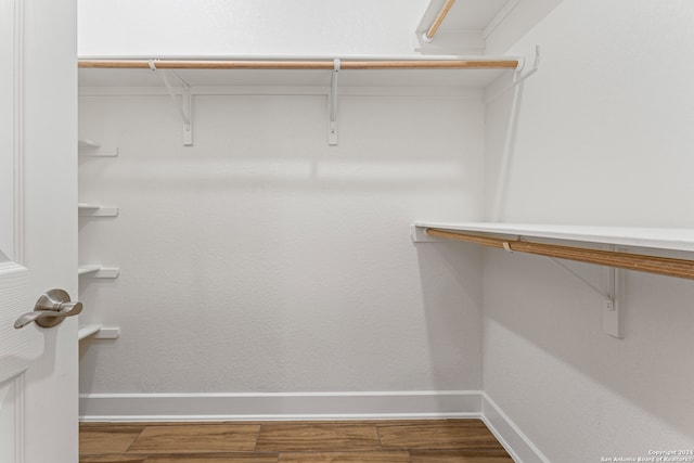 spacious closet featuring hardwood / wood-style floors