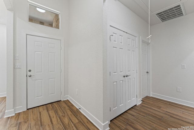 foyer entrance with dark hardwood / wood-style flooring