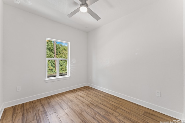 empty room with ceiling fan and light wood-type flooring