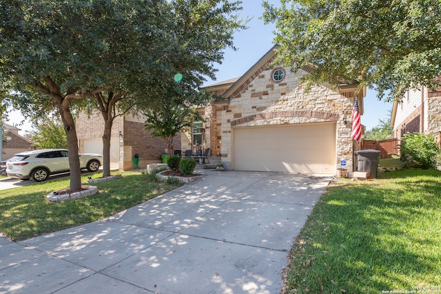 view of front facade featuring a garage and a front yard