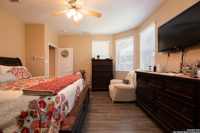 bedroom featuring dark hardwood / wood-style flooring and ceiling fan