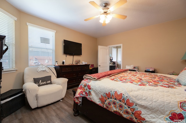 bedroom with ceiling fan and hardwood / wood-style flooring