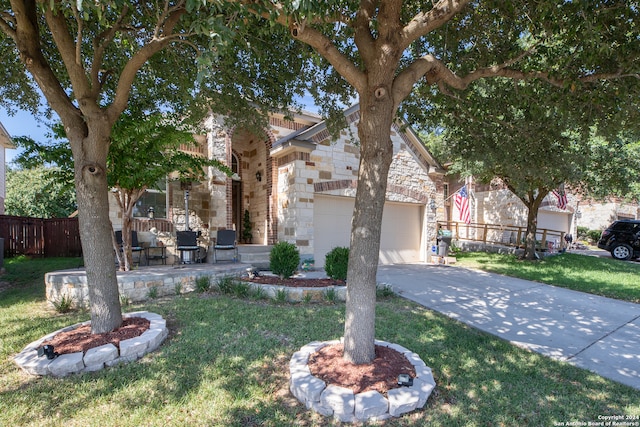 view of front of house with a front lawn and a garage