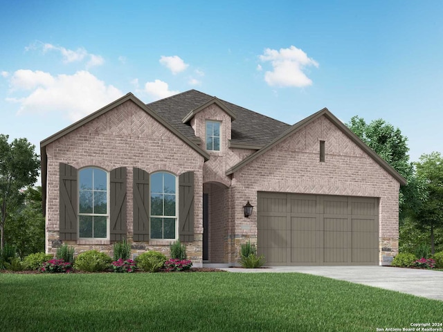 french country home featuring a garage and a front lawn