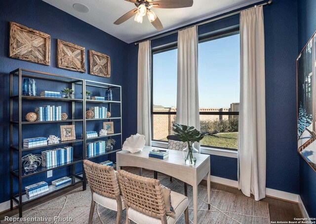 office area with ceiling fan and hardwood / wood-style floors