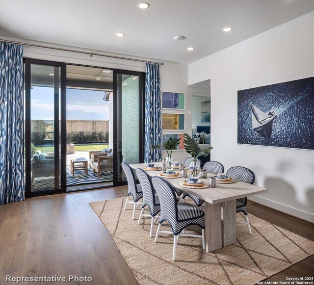 dining room with wood-type flooring