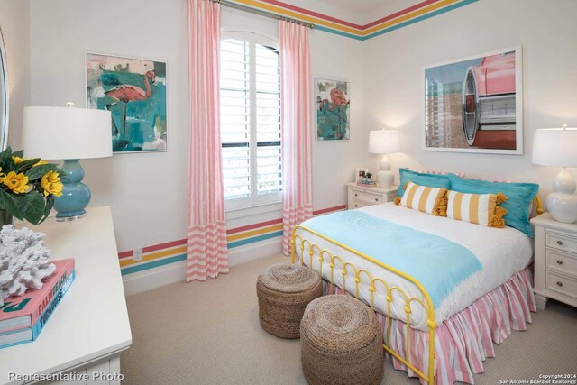 carpeted bedroom featuring crown molding and multiple windows