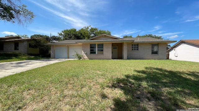 single story home with a front lawn and a garage