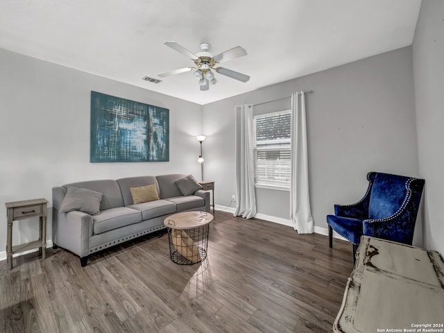 living room featuring ceiling fan and hardwood / wood-style floors