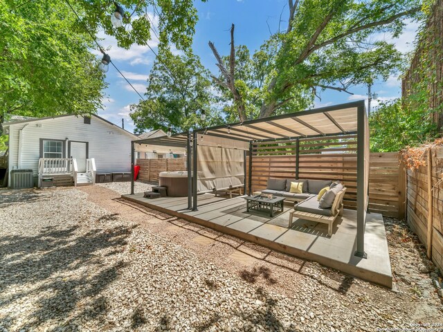 view of yard with an outdoor living space, cooling unit, and a patio area