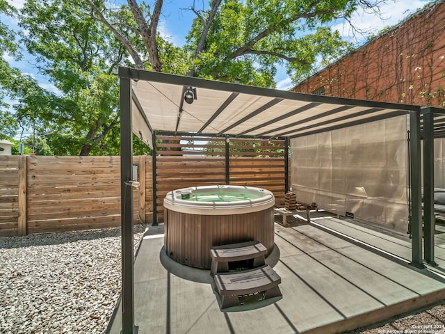 view of patio / terrace featuring a hot tub