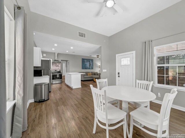 dining space featuring hardwood / wood-style flooring and ceiling fan