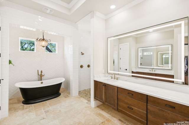 bathroom with crown molding, a soaking tub, stone finish flooring, vanity, and walk in shower