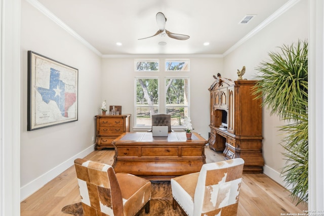 office with light wood-style floors, crown molding, and baseboards