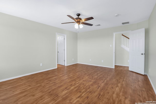 spare room with ceiling fan and hardwood / wood-style floors