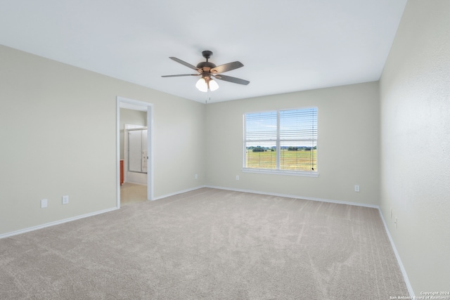 carpeted empty room with ceiling fan