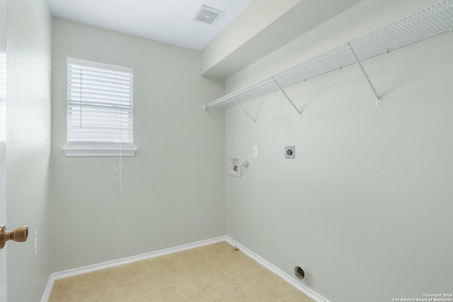 laundry area featuring hookup for an electric dryer, laundry area, washer hookup, visible vents, and baseboards