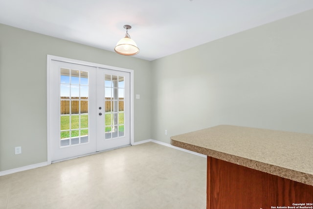 interior space with french doors and light tile patterned floors