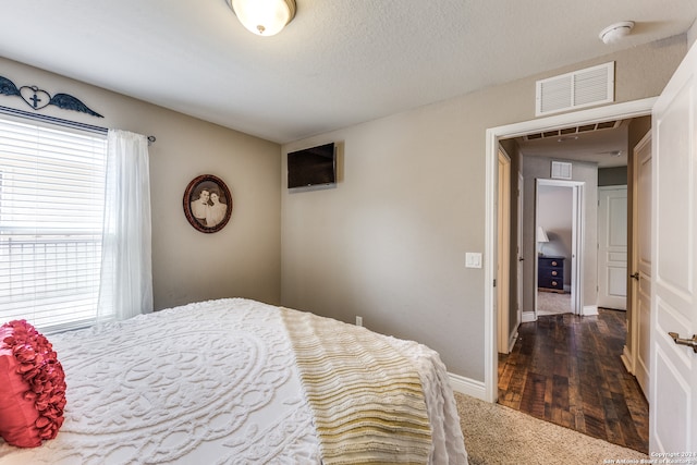 bedroom featuring hardwood / wood-style flooring