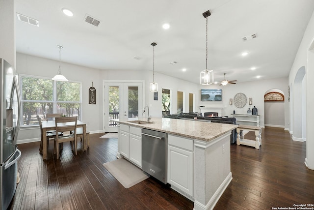 kitchen with ceiling fan, dark wood-type flooring, white cabinets, appliances with stainless steel finishes, and sink