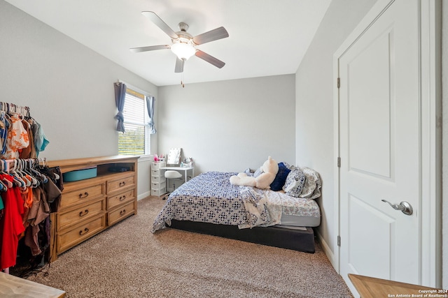 bedroom featuring ceiling fan and carpet floors