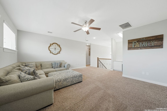 living room with carpet floors and ceiling fan