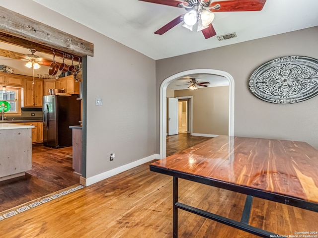 interior space featuring ceiling fan and dark hardwood / wood-style flooring