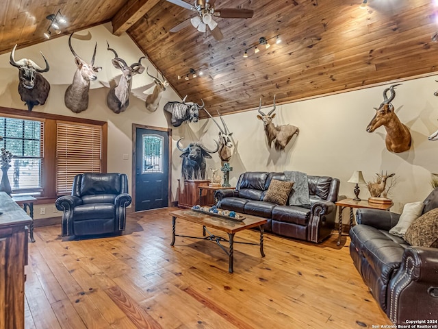 living room featuring ceiling fan, light wood-type flooring, lofted ceiling with beams, and wood ceiling