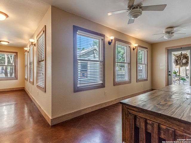 unfurnished dining area with ceiling fan