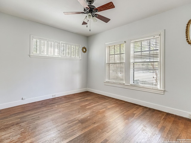 empty room featuring ceiling fan and hardwood / wood-style floors