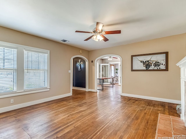 spare room featuring ceiling fan and hardwood / wood-style floors