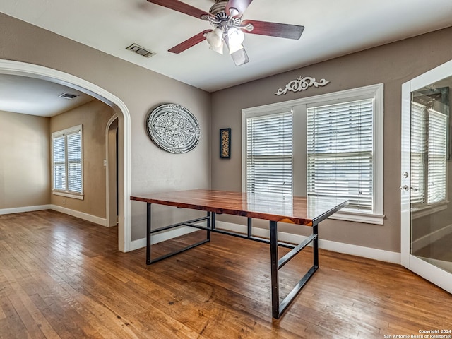 interior space with ceiling fan and wood-type flooring