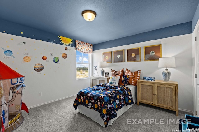 carpeted bedroom featuring a textured ceiling