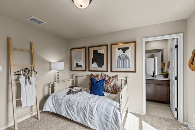 carpeted bedroom featuring connected bathroom