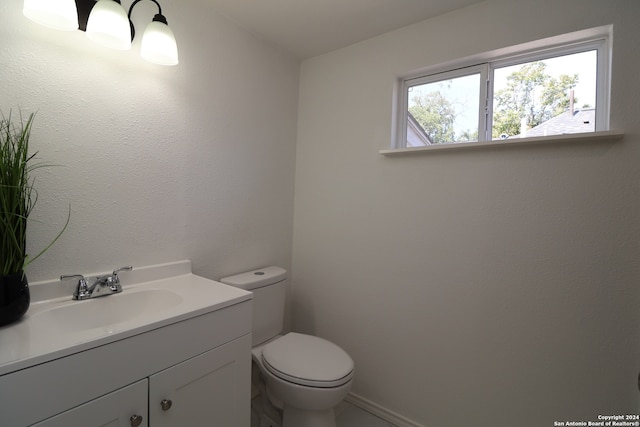 bathroom with toilet and vanity