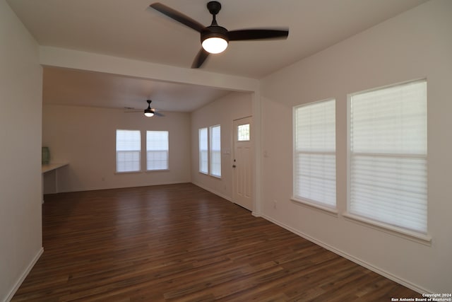 interior space featuring ceiling fan and dark wood-type flooring