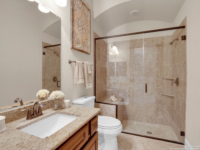 full bathroom featuring toilet, a shower stall, tile patterned flooring, and vanity