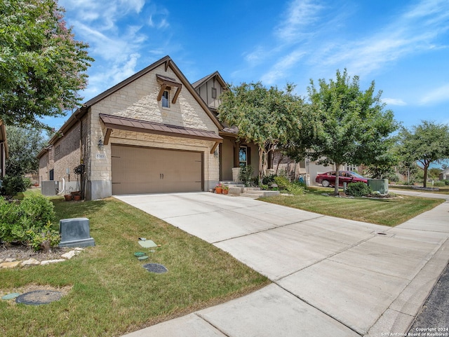 view of front of home with cooling unit and a front lawn