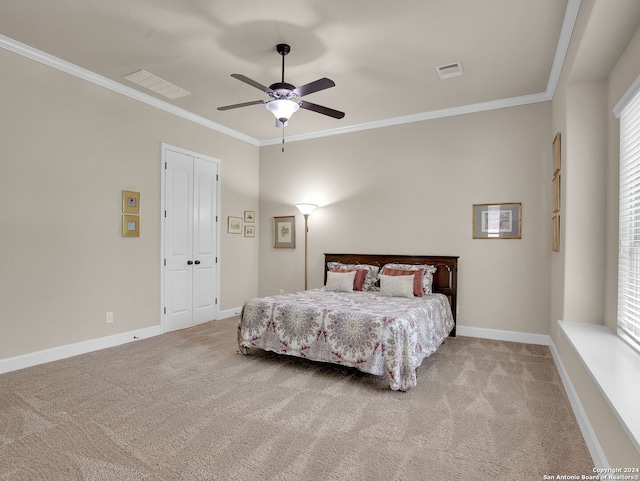 bedroom with ceiling fan, carpet floors, crown molding, and multiple windows