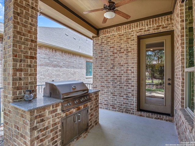 view of patio with ceiling fan, a grill, and exterior kitchen