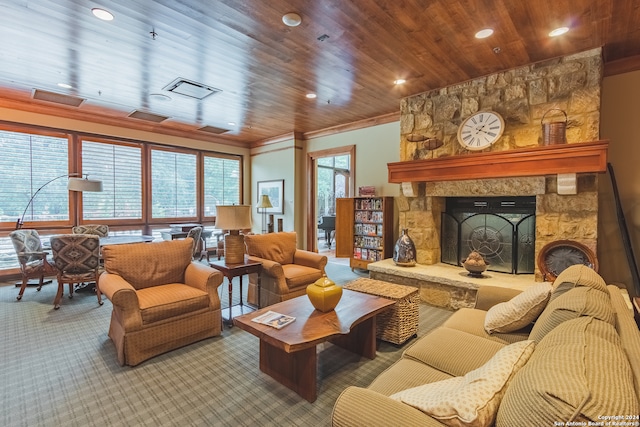 living room with carpet, a stone fireplace, wood ceiling, and ornamental molding