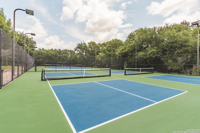 view of tennis court with fence