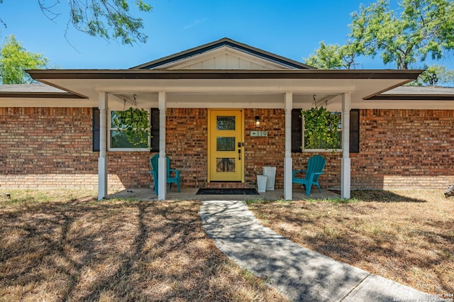 entrance to property with a porch